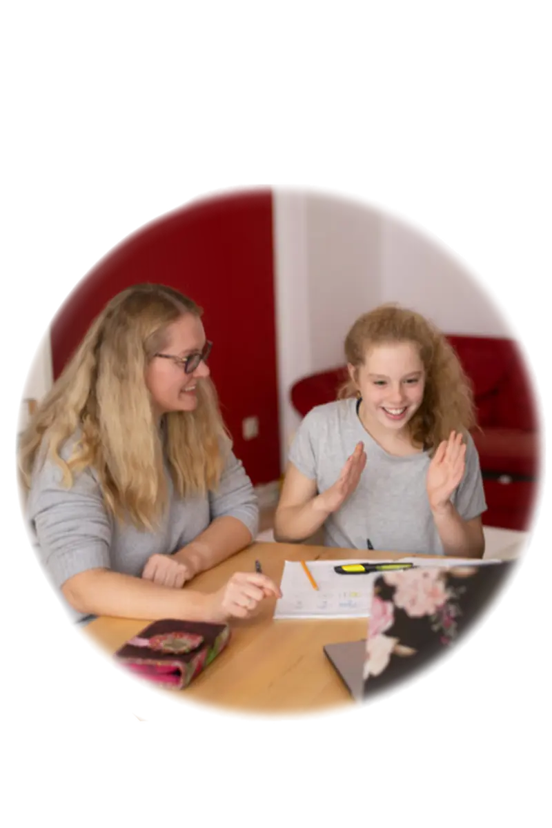Parent and student smiling during online tutoring